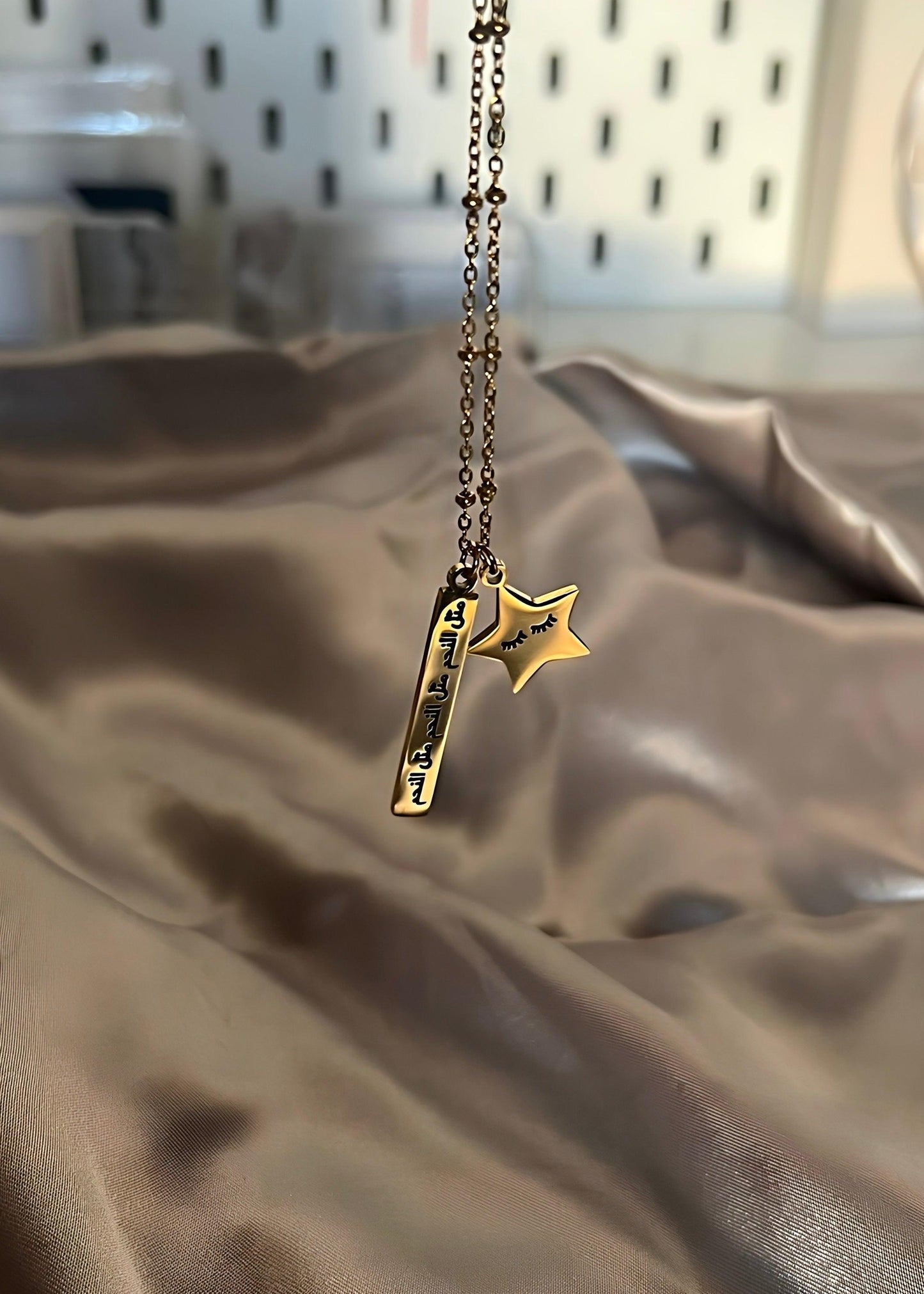Arabic necklace, carved with Arabic writing meaning like a star