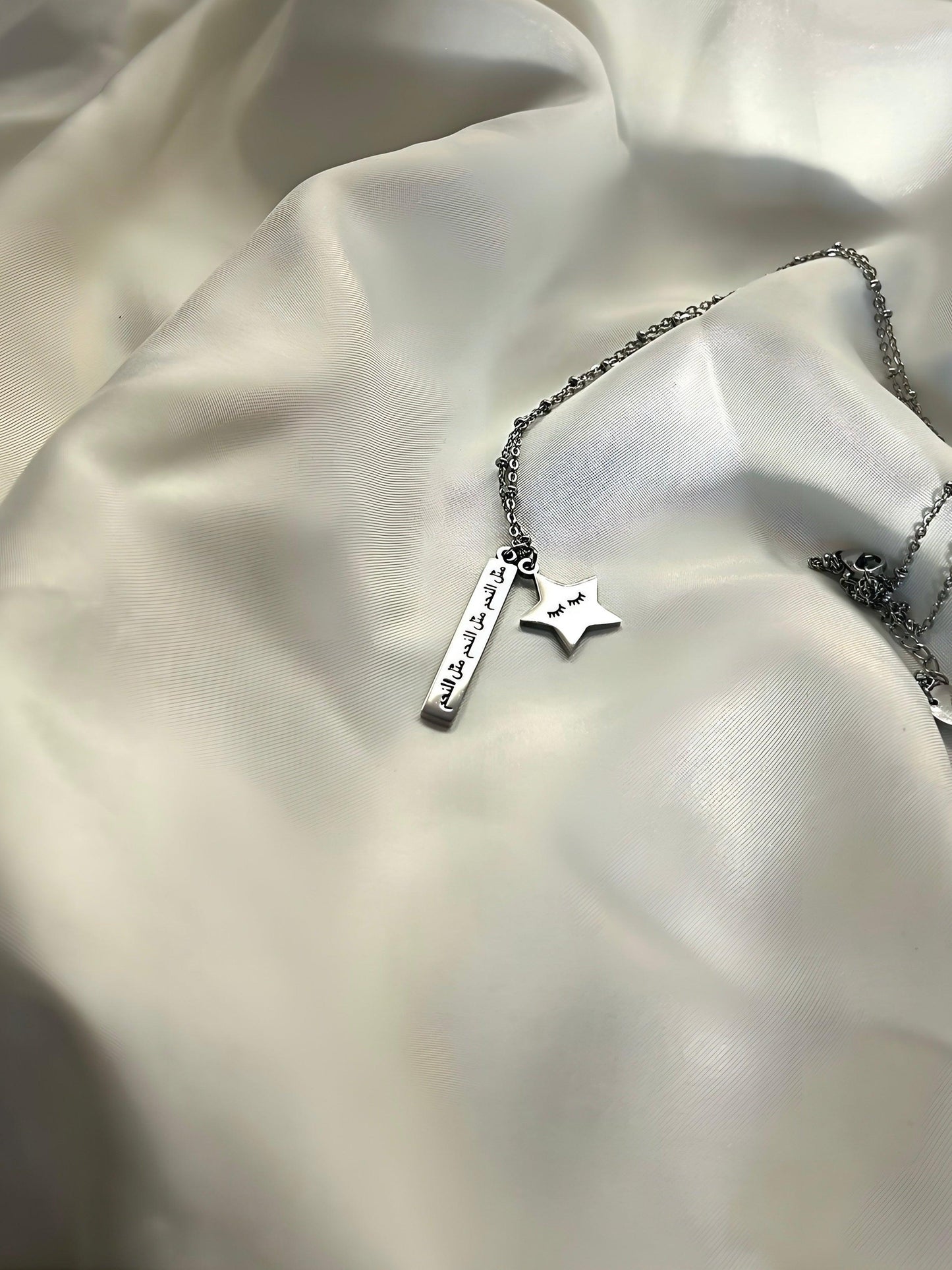 Arabic necklace, carved with Arabic writing meaning like a star  